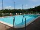 Relaxing community pool area with plenty of seating and shade for residents to enjoy at 34421 Countryside Dr, Wesley Chapel, FL 33543