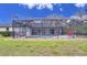 Spacious backyard featuring a screened-in pool area, perfect for enjoying outdoor living and entertaining at 4553 31St E Ct, Bradenton, FL 34203