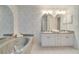 Bathroom showcasing double sinks, a soaking tub, and a calming atmosphere for a relaxing experience at 4553 31St E Ct, Bradenton, FL 34203