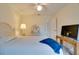 Relaxing bedroom featuring a comfortable bed, soft lighting, and a television for your enjoyment at 4553 31St E Ct, Bradenton, FL 34203