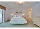 Cozy bedroom with soft lighting, framed wall art, and sliding glass doors at 4553 31St E Ct, Bradenton, FL 34203