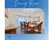 Formal dining room features a wood table, elegant chandelier, and plenty of room for entertaining at 4553 31St E Ct, Bradenton, FL 34203