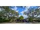 Charming single-story home featuring lush landscaping and mature trees, offering a serene curb appeal at 4553 31St E Ct, Bradenton, FL 34203