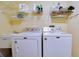 Well-equipped laundry room with washer, dryer, and storage for all your laundry essentials at 4553 31St E Ct, Bradenton, FL 34203