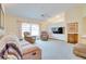 Inviting living room featuring comfortable seating, a ceiling fan, and a built-in entertainment center at 4553 31St E Ct, Bradenton, FL 34203