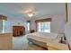 Bright main bedroom with comfortable furnishings and sliding doors to the outdoor pool area at 4553 31St E Ct, Bradenton, FL 34203