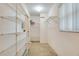 Organized walk-in closet with ample shelving and storage space, providing convenient storage solutions at 4553 31St E Ct, Bradenton, FL 34203