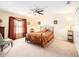 Comfortable bedroom with a ceiling fan, closet, and window with coverings at 534 19Th Nw St, Ruskin, FL 33570