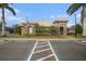 Community clubhouse featuring tile roof, stone accents, and designated accessible parking at 534 19Th Nw St, Ruskin, FL 33570