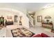 Open-concept living space featuring a staircase, dining area, and comfortable seating arrangement at 534 19Th Nw St, Ruskin, FL 33570