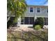 Home backyard with brick patio, lush lawn and attractive landscaping at 558 Harbor Ridge Dr, Palm Harbor, FL 34683