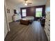 Spacious primary bedroom with laminate floors, dual windows, ceiling fan, and ample natural light at 558 Harbor Ridge Dr, Palm Harbor, FL 34683