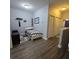 Bedroom with closet and doorway entrance with gray walls and luxury vinyl plank flooring at 558 Harbor Ridge Dr, Palm Harbor, FL 34683