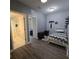 Bedroom featuring gray walls with two entrances, vinyl flooring, and minimalistic decor at 558 Harbor Ridge Dr, Palm Harbor, FL 34683
