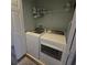 Bright laundry room featuring a Whirlpool washer and dryer at 558 Harbor Ridge Dr, Palm Harbor, FL 34683