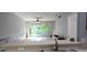 Bright living room with sliding glass doors leading to the outdoor space; tile flooring throughout at 558 Harbor Ridge Dr, Palm Harbor, FL 34683