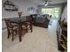 Open concept living area with dining table, comfortable seating, and natural light at 558 Harbor Ridge Dr, Palm Harbor, FL 34683