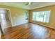 Versatile bonus room with wood floors, neutral walls, and views of backyard creating a cozy atmosphere at 1604 Boswell Ln, New Port Richey, FL 34655