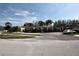 Gated community entrance with well-manicured landscaping, enhancing privacy and curb appeal at 1604 Boswell Ln, New Port Richey, FL 34655