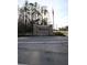 Wyndgate community sign with an American flag waving nearby at 1604 Boswell Ln, New Port Richey, FL 34655