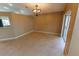 Bright, airy dining room with tile floors, modern light fixture, and sliding glass doors at 1604 Boswell Ln, New Port Richey, FL 34655