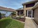 Charming exterior of a home with a well-kept lawn and landscaped garden beds at 1604 Boswell Ln, New Port Richey, FL 34655