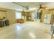 Spacious two car garage with ceiling fans, laundry and storage at 1604 Boswell Ln, New Port Richey, FL 34655