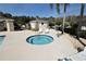 Inviting community hot tub with lounge chairs, ideal for relaxation and socializing at 1604 Boswell Ln, New Port Richey, FL 34655