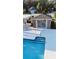 Community pool with outdoor kitchen at 1604 Boswell Ln, New Port Richey, FL 34655