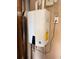 A close-up shot featuring a NAVIEN 130 tankless water heater, an efficient and space-saving home amenity at 1604 Boswell Ln, New Port Richey, FL 34655