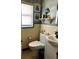 Cozy bathroom with a patterned floor, tiled walls, and stylish fixtures at 16301 Redington Dr, Redington Beach, FL 33708