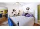Comfortable bedroom with wood floors and a ceiling fan at 16301 Redington Dr, Redington Beach, FL 33708