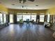 Spacious room with new flooring, multiple windows, and lots of natural light at 16301 Redington Dr, Redington Beach, FL 33708