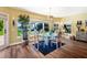 Sunny dining area boasts a modern glass table and views of the waterway at 16301 Redington Dr, Redington Beach, FL 33708