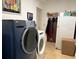 Functional laundry room with modern appliances and tile flooring at 16301 Redington Dr, Redington Beach, FL 33708