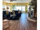 Inviting living room features hardwood floors, a fireplace, and lots of natural light at 16301 Redington Dr, Redington Beach, FL 33708