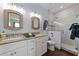 Stylish bathroom with double vanity, granite counters, and luxurious glass shower for modern comfort at 206 Church Ave, Bradenton Beach, FL 34217
