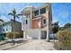Charming two-story home with inviting balcony and a lush yard at 206 Church Ave, Bradenton Beach, FL 34217