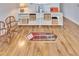 Basement display case with baseball memorabilia and wood flooring at 214 Bon Vie Pl, Valrico, FL 33594