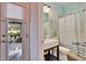 Charming bathroom with decorative shower curtain and beach-themed wall art at 214 Bon Vie Pl, Valrico, FL 33594