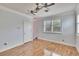 Spacious bedroom featuring a ceiling fan and shuttered window at 214 Bon Vie Pl, Valrico, FL 33594