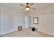 Simple bedroom with carpet, ceiling fan, and double door closet at 214 Bon Vie Pl, Valrico, FL 33594