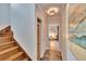 Hallway features wood stairs and a closet with stylish woven baskets at 214 Bon Vie Pl, Valrico, FL 33594