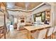 Modern kitchen with stainless steel appliances, a spacious island with bar seating, and unique wood ceiling at 214 Bon Vie Pl, Valrico, FL 33594