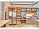 Well-organized kitchen with built-in stainless steel appliances and ample pantry storage with tile floors at 214 Bon Vie Pl, Valrico, FL 33594