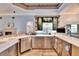 Contemporary kitchen featuring stainless steel appliances, marble countertops, and custom cabinetry at 214 Bon Vie Pl, Valrico, FL 33594