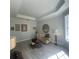 Cozy living room showcasing unique decor, stylish furniture, and tray ceiling at 214 Bon Vie Pl, Valrico, FL 33594