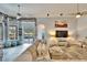 Bright living room features tile floors and sliding glass doors leading to a pool at 214 Bon Vie Pl, Valrico, FL 33594