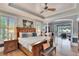 Spacious main bedroom with hardwood floors and access to the outdoor living space at 214 Bon Vie Pl, Valrico, FL 33594