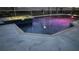Nighttime view of a pool and spa area with ambient lighting, creating a relaxing atmosphere at 214 Bon Vie Pl, Valrico, FL 33594